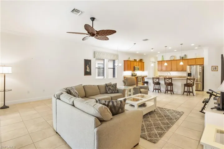 Spacious family area seamlessly connected to the kitchen, offering a bright and inviting layout.