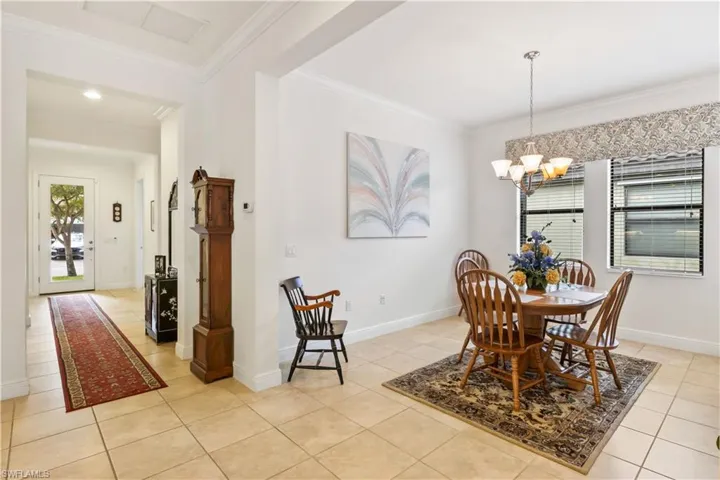 Elegant dining area overlooking the front entry, offering a cohesive and inviting layout.