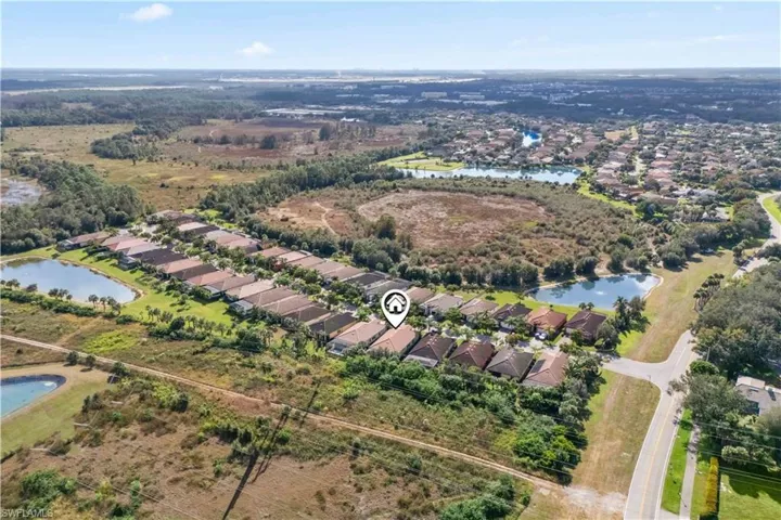 Aerial image highlighting the community layout, mature landscaping, and scenic preserve surroundings.