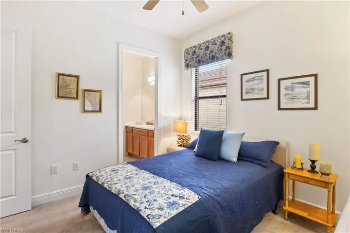Generous secondary bedroom with an attached full bathroom, offering convenience and a private retreat.