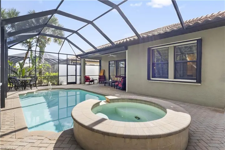 Seamless indoor-outdoor flow to a resort-style pool and spa area.
