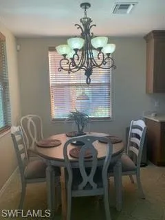 Dining area featuring plenty of natural light and hanging lights