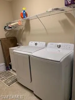 Laundry area featuring independent washer and dryer