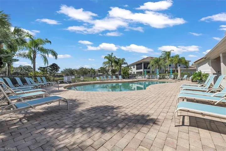 Community pool with a patio area