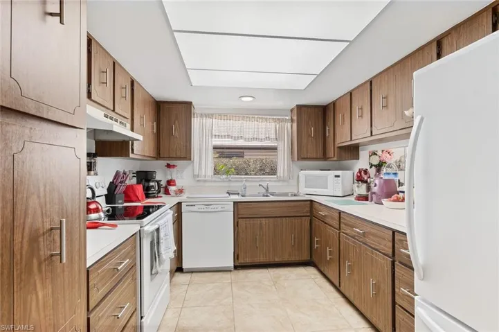 Fully applianced kitchen in unit #1 with tile floors.