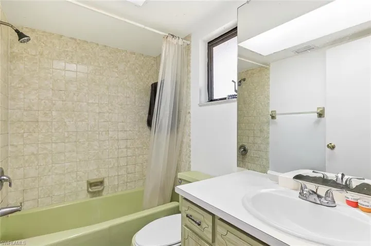 Bathroom one with tile flooring and shower/tub combo in unit #2.