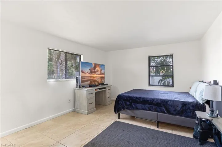 Bedroom two with tile flooring in unit #2.