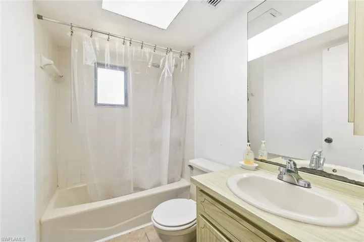 Bathroom two with tile flooring and shower/tub combo in unit #2.