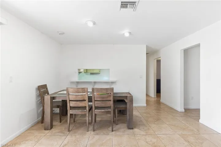 Dining area with tile flooring in unit #2.