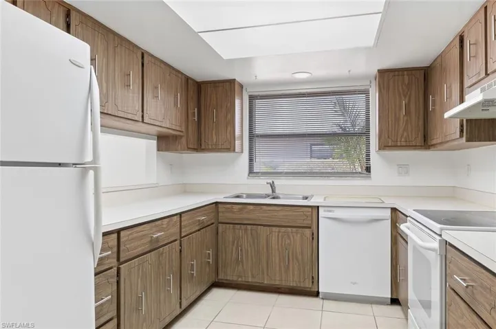 Fully applianced kitchen with tile flooring and in ceiling lighting in unit #3.