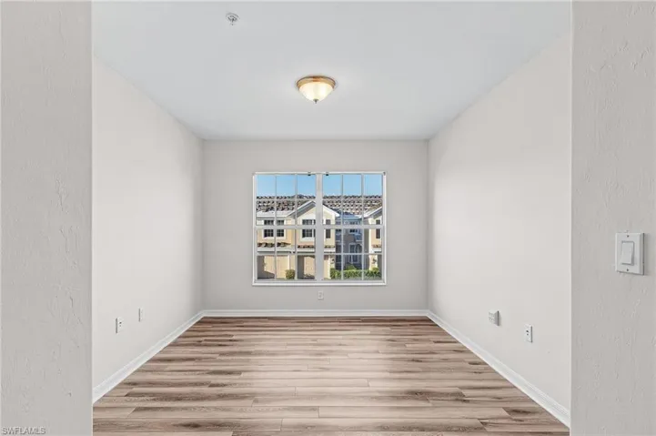 Spare room with light wood-type flooring