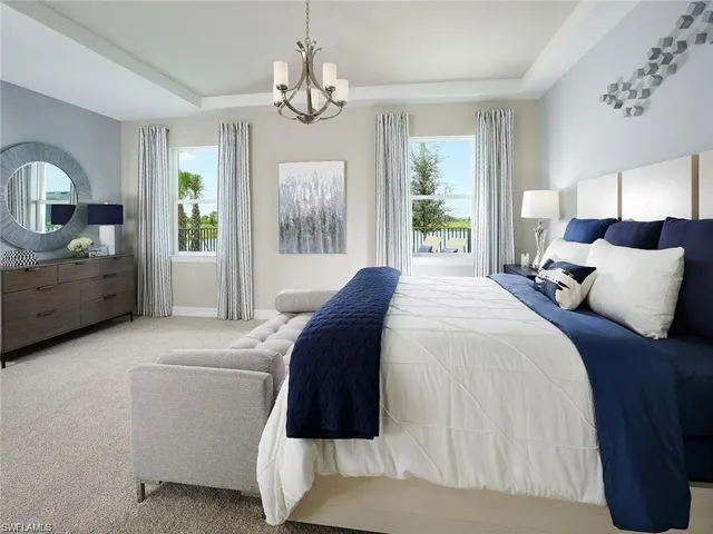 Living area featuring healthy amount of natural light, recessed lighting, and a chandelier