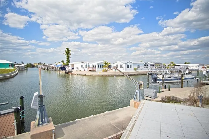 Dock area featuring a residential view and a water view