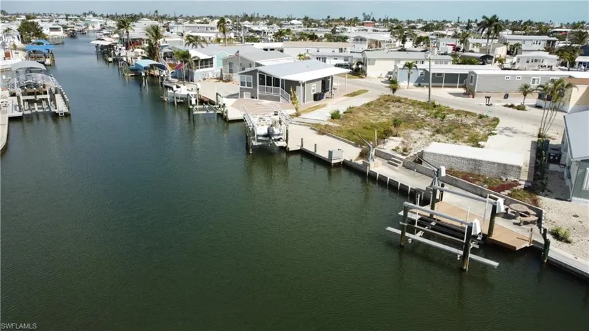 Aerial perspective of suburban area with a large body of water