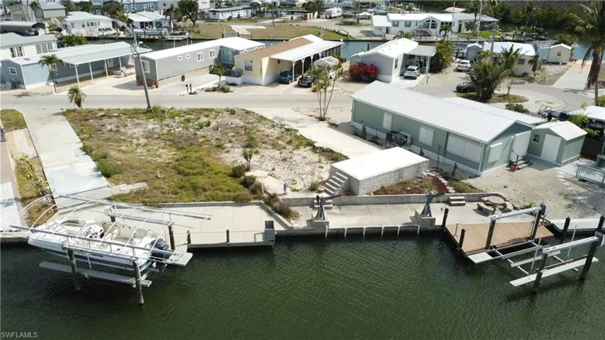 Aerial perspective of suburban area with a large body of water