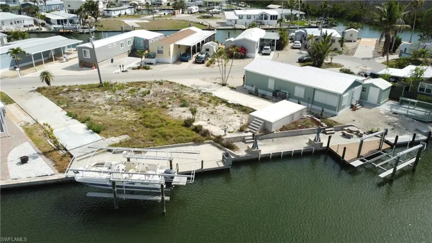 Aerial perspective of suburban area with a large body of water
