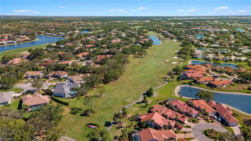 "The Par 5 first hole" and surrounding homes.