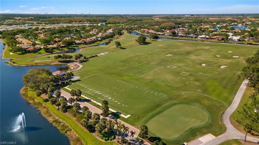 View of the practice range alternating hitting golf balls in 2 directions rotating daily and a 2nd par 4 practice hole to the left of the range.