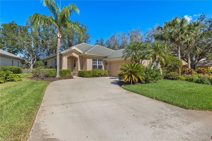 Driveway leading to the front door and garage.