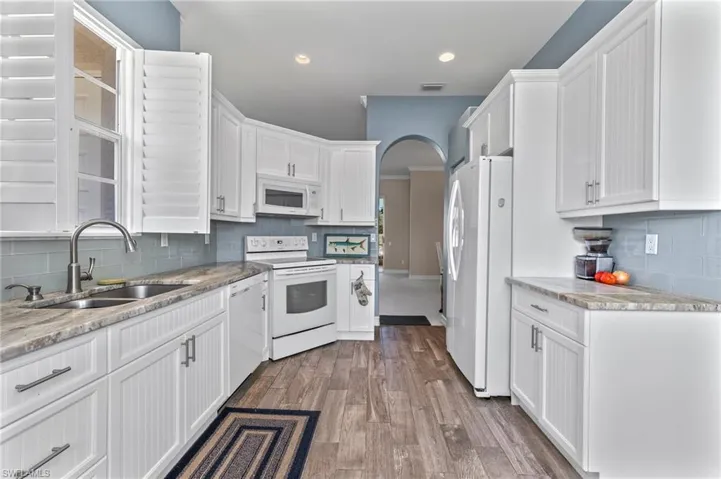 Kitchen cabinets with self closing doors and drawers.