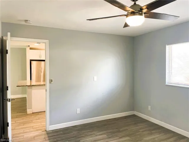 Spare room featuring light wood-style floors and a ceiling fan