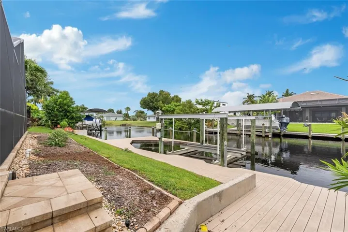 Dock area featuring a lanai and a water view