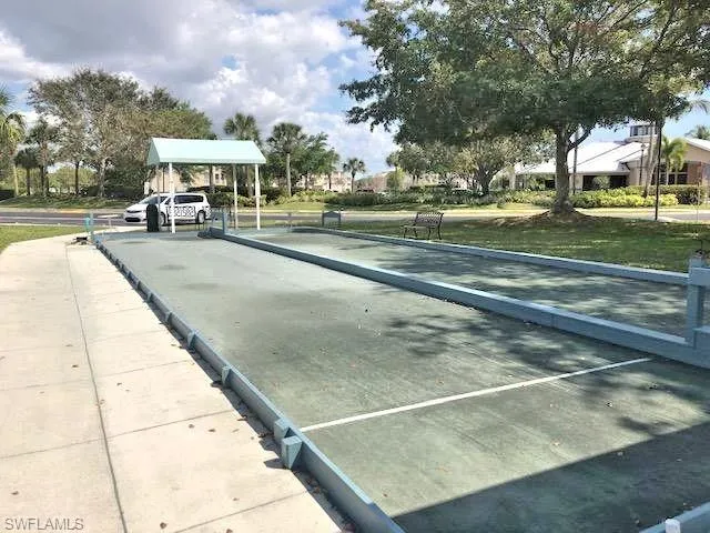 View of property's community with a bocce ball area