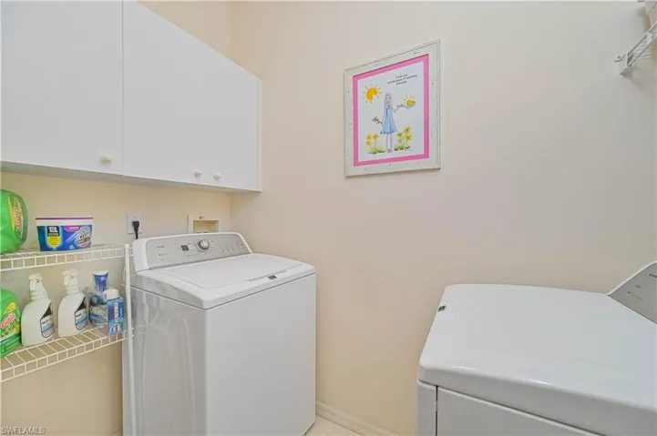 Laundry room with washer and dryer and cabinet space