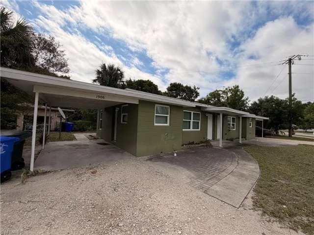 Single story home featuring an attached carport and driveway