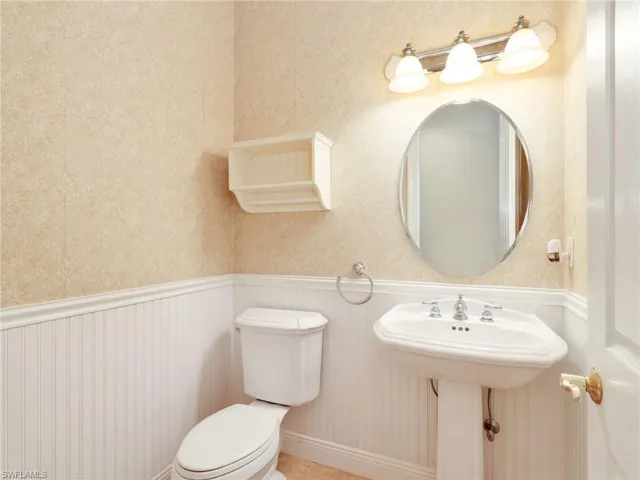 Bathroom featuring a wainscoted wall