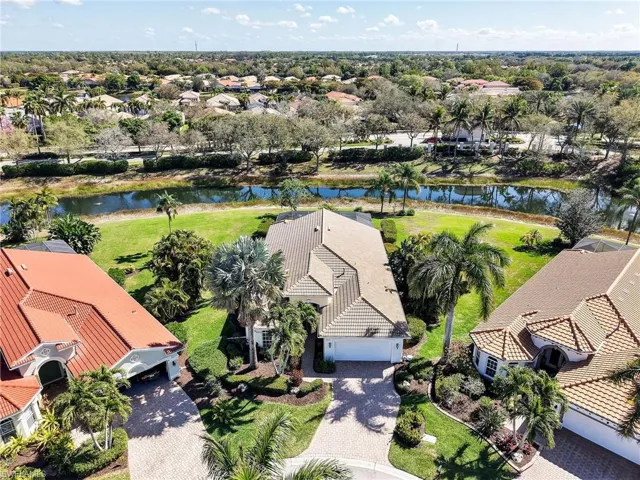Aerial perspective of suburban area with a nearby body of water
