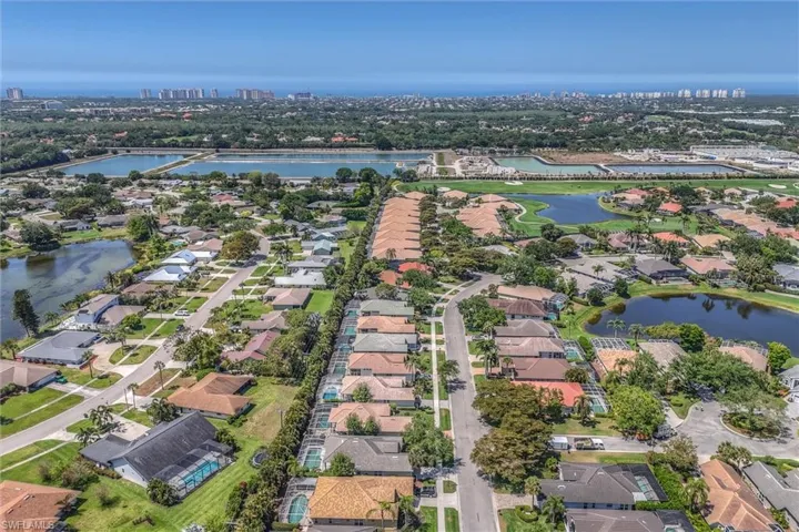 Birds eye view of property with a residential view and a water view
