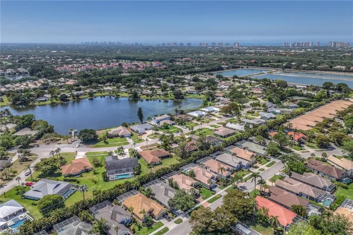 Aerial view featuring a residential view, a water view, and a view of city