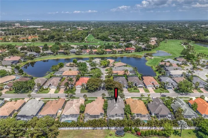 Drone / aerial view featuring a residential view, golf course view, and a water view