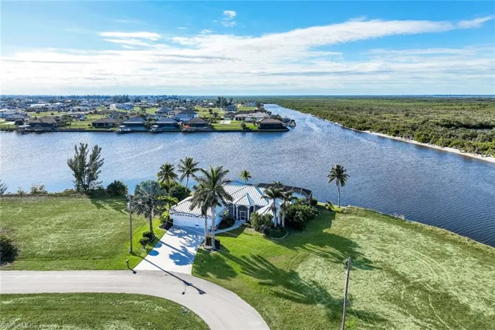 Aerial view of residential area featuring a large body of water
