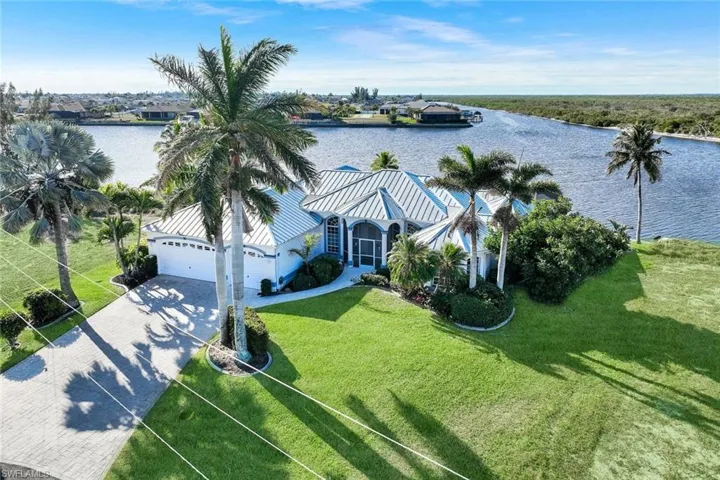 View from above of property with a nearby body of water