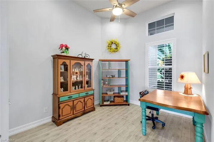Home office or Bedroom featuring a ceiling fan and custom tile flooring