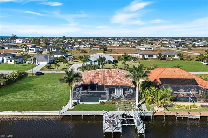 Aerial perspective of suburban area with a large body of water