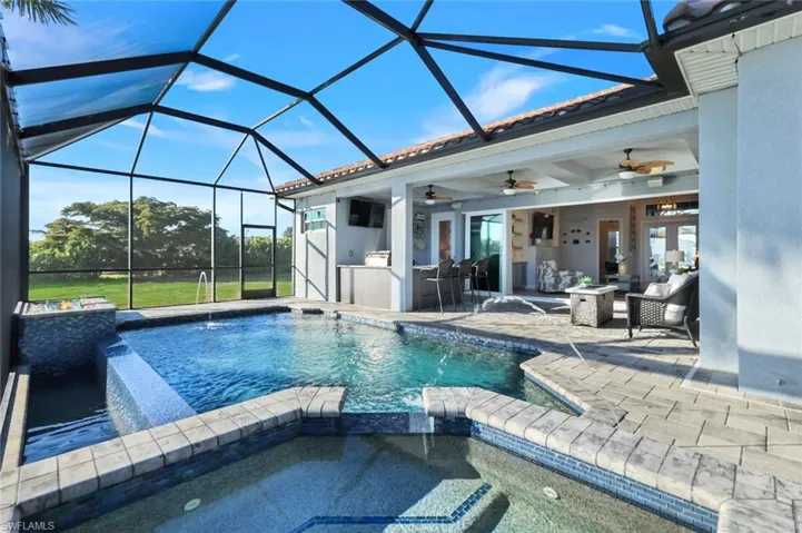 View of heated pool and spa and water features