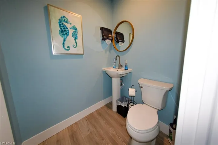 All 4 baths have highboy toilets and pedestal sinks.