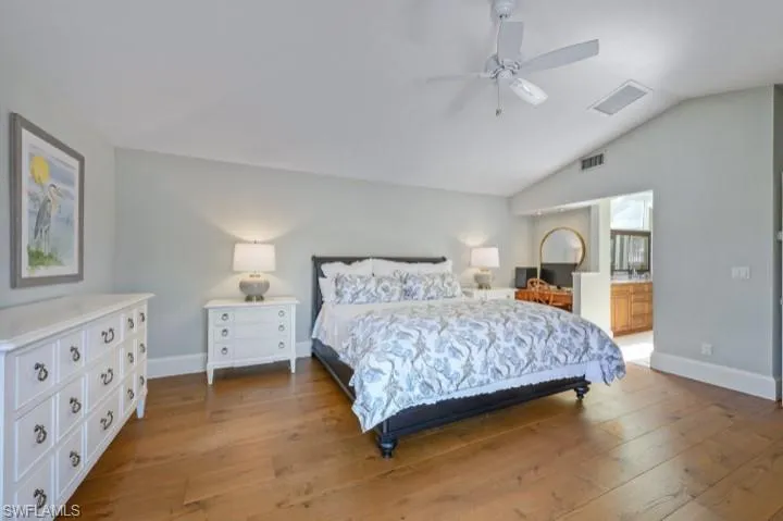 Primary Bedroom featuring vaulted ceiling and Ensuite Bathroom