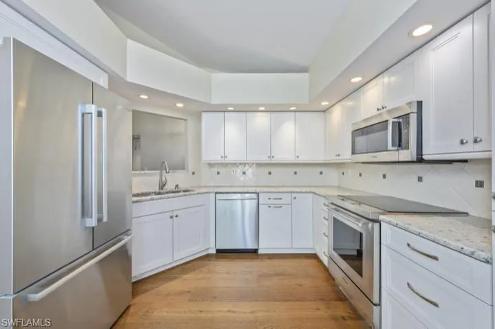 Kitchen featuring Wolf Range and new cabinetry.