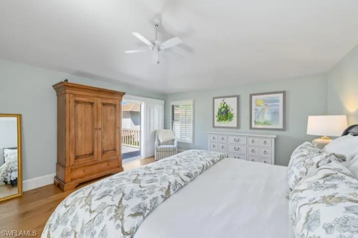Spacious Primary Bedroom with new hurricane impact sliders leading to a sundeck