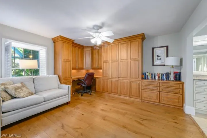Bedroom/Office with Murphy Bed and sliders leading to screened lanai.