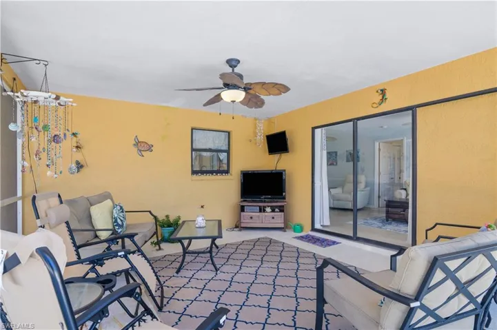 View of patio with a ceiling fan