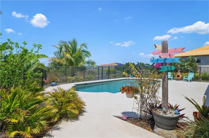 View of swimming pool with a fenced in pool, a patio area, and fence
