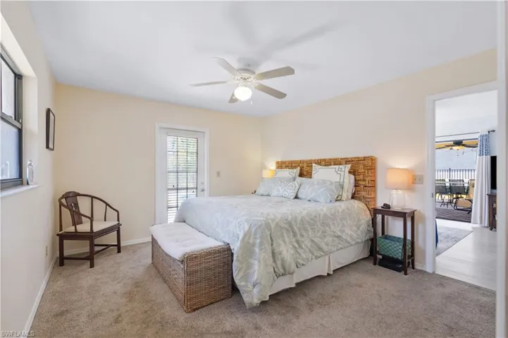 Bedroom featuring carpet floors, baseboards, access to outside, and ceiling fan