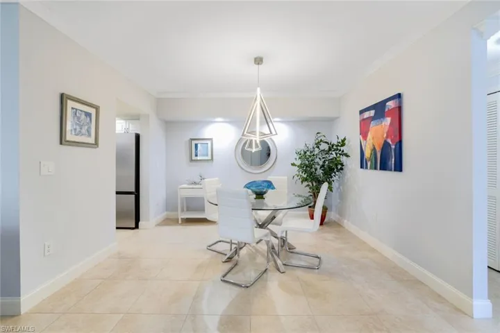Dining area with custom light fixture