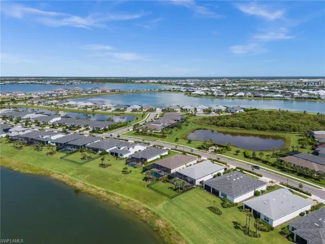 Aerial perspective of suburban area with a large body of water
