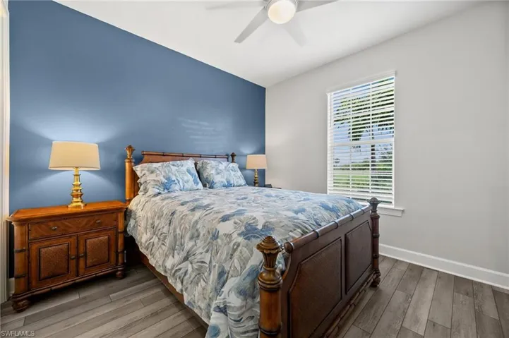 Bedroom with wood finished floors and ceiling fan